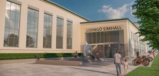 Byggnad med entré, människor och cyklar utanför.