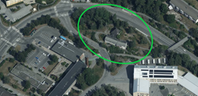 Flygfoto över fastigheten som  är inringad.